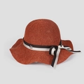 Detail of terracotta wavy straw hat featuring a striped bow and silver star pendant - M (56-58cm) / Orange Red