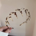 Brown tortoise shell wavy headband made of translucent resin for firm anti-slip grip - Russet Wavy Headband