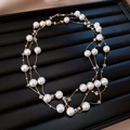 Elegant multi-layer gold pearl and crystal bead necklace displayed on a black tray - 100# Necklace - Gold - White - 12mm Pearl