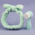 Detail of mint green plush bow headband and manual facial cleansing brush set - Small Standing Brush + Green Plush Hairband Set / Green