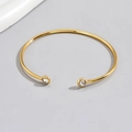 Exaggerated golden open cuff bracelet featuring two sparkling transparent rhinestones - 0965-Gold-Open Double Stone