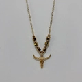 Detailed view of the gold bull skull pendant with decorative beaded chain and link necklace - Bull Skull - Gold Beads