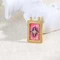 Macro shot of gold tarot pendant with pink gradient enamel and sparkling star detail - Pink Purple Gradient Starburst Style (ZYN-DMK874G-2)