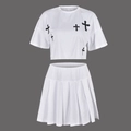 Detail of white two-piece set featuring black cross print cropped tee and pleated mini skirt - XL / White