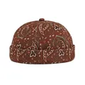 Retro rust-red docker hat featuring white paisley patterns and stitched canvas panels - Adjustable / Coffee