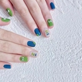 Press-on nails featuring green pickle rick art and blue minimalist line designs - HY264 Graffiti Pickle Rick