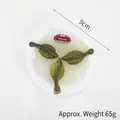 Realistisch 9cm kunstmatig zeevruchtenornament met groene vissen en kerstetiket - Zeevis
