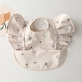 Waterproof baby feeding bib in apricot with cotton print and ruffled wing sleeves - Wings - Little Cotton / One Size