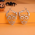 Silver skull earrings on orange background with Halloween pumpkin and spider decorations - FX181 (Silver Skeleton Head)