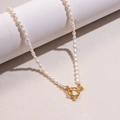 Double-layered freshwater pearl necklace with a vintage golden toggle clasp design - Gold Pearl