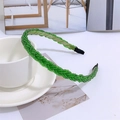 Macro detail of green beaded braided headband with elegant pearl texture and fabric finish - Green