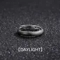Vintage adjustable silver ring with textured wood-grain finish on black background - Daylight