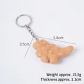 Creative dinosaur chicken nugget keychain in crispy golden finish with dimensions and weight - Dinosaur Nugget-With Keychain
