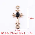 Cross alloy pendant in KC gold finish with an oval black gemstone for jewelry making - 11792 Gold Black