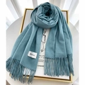 Thick teal cashmere scarf with tassels and brand label on white elegant background - Teal