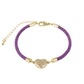 Detail of purple braided bracelet featuring a gold heart charm with cubic zirconia - Heart / Purple