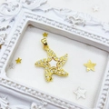 Starfish charm pendant in gold plated copper with micro-set zircon stones on a white background - Starfish / Gold