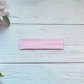 Pink high-elastic yoga sports headband made of soft knit fabric shown on a blue tray - Light Pink