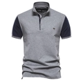 Detail of color-block polo shirt with grey body, navy sleeves and small chest logo - Light Gray