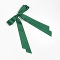 Close-up of dark green satin double-layered bow hair clip with long ribbons and silky texture - Christmas Green