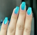 Macro shot of short cat-eye press-on nails in glossy turquoise with polarizing effect - Lake Blue Cat Eye Style-With Yellow Jelly Glue (CW625) / 24 Pcs/Set