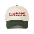Detail of embroidered 'IT'S A BAD DAY TO BE A HOT DOG' text on two-tone baseball cap - Army Green