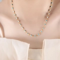 Golden titanium steel necklace with white and blue-green evil eye charm beads - White Green Necklace