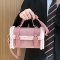 Zylinder-Handtasche aus pinkem Lammwoll-Plüsch mit Metallschnalle und Schultergurt - Rosa