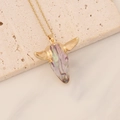Macro detail of bohemian bull head pendant with iridescent pearl finish on golden chain - Rainbow Pearlescent Bull Head (3#)