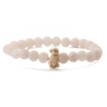 Detailed macro view of 8mm white agate bead bracelet with a carved penguin charm pendant - White Weathered Stone