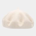 Detail view of a cream-colored wool beret featuring a soft texture and classic top stem - Off-White