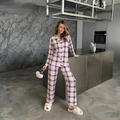 Cozy pink and black plaid pajama set with button-up long sleeves and matching trousers - S / Pink