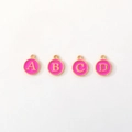 Detail of A B C D alphabet charms with pink enamel and gold finish for DIY jewelry - Letter A / Fuschia
