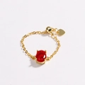 Detail of gold chain ring with oval red zircon, adjustable slider, and heart charm - Red Zirconia-Gold