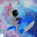 Detail of astronaut building blocks with pink rabbit ears riding on a blue whale - 6045 Whale Astronaut with Light