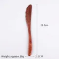 Japanese style nanmu wood butter knife with serrated edge and natural brown grain finish - Knife