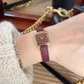 Women's vintage square gold watch featuring a deep red leather strap on the wrist - Gold/Wine Red (Square)