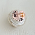 Detailed close-up of rose gold acrylic heart cake topper with floral engraving and Happy Birthday - Heart Floral-Happy Birthday / Rose Gold
