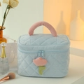 Blue corduroy makeup bag with pink handle and flower zipper detail on a bright desk - Square Bag / Sky Blue