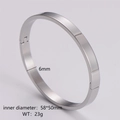Detailed specs showing 6mm width and 58x50mm inner diameter of a polished steel bangle - Women's Steel Color