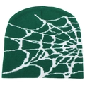 Close-up of deep green knit beanie featuring a detailed white spider web jacquard pattern - One Size / Green