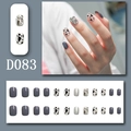 Detail of 24pcs press-on nails with cow print, silver glitter, and rhinestone accents - D083 (Glue Type)