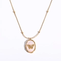 Gold locket necklace with butterfly accent and mother of pearl inlay on white background - Butterfly Shell Opening Necklace