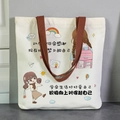 White canvas tote bag with brown straps and cute cartoon girl print for students - Positive