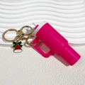 Pink mini tumbler keychain with gold ring and red green festive bell charm accessory - Christmas Rose Red