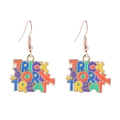 Detail of Trick or Treat Halloween earrings with colorful bats, candy, and stars - Halloween Letters Star