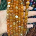 Naturachat-Rundperlen in Orange und Gelb mit Streifen für DIY-Schmuckherstellung - 6mm (ca. 58 Perlen) / Gestreifter orangefarbener Achat A365