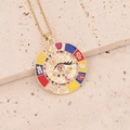 Macro detail van gouden evil eye hanger met emaille gelukssymbolen op beige steen - Micro Ingelegde Zirkonia Geluksplaat (4#)