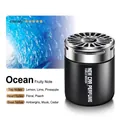 Car air freshener solid balm in ocean scent with lemon and cedar notes in black jar - Ocean