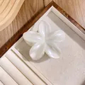 Elegant pearl white plumeria flower hair claw clip displayed on a premium jewelry tray - Glossy Pearl White